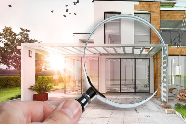 Maison avec image d'une loupe